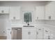 Bright kitchen showcasing white cabinetry, stainless steel appliances, and elegant quartz countertops for a sleek design at 823 32Nd Ne St, Conover, NC 28613