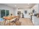 Bright, modern kitchen with white cabinets, stainless steel appliances, and an adjacent dining area at 823 32Nd Ne St, Conover, NC 28613