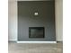Living room wall featuring a dark gray accent wall and electric fireplace at 823 32Nd Ne St, Conover, NC 28613