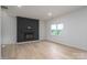 Bright and airy living room with a cozy fireplace feature, enhanced by large windows and light-colored hardwood floors at 823 32Nd Ne St, Conover, NC 28613