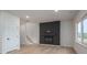 Inviting living room with a modern fireplace, light wood flooring, and ample natural light, perfect for relaxation at 823 32Nd Ne St, Conover, NC 28613