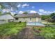Backyard of a single-Gathering home featuring a deck, trees and green space at 8520 Mission Hills Rd, Charlotte, NC 28227