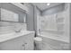 Bathroom with tub and shower combination, bright lighting, and modern vanity at 8520 Mission Hills Rd, Charlotte, NC 28227