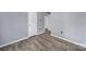 Cozy bedroom with hardwood floors, two closets for storage, and neutral gray walls at 8520 Mission Hills Rd, Charlotte, NC 28227