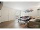 Bright living room boasting laminate wood floors, a large window, and cozy seating arrangement at 924 Carrington Dr, Charlotte, NC 28214