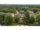 Expansive aerial view showing the property and surrounding neighborhood with mature trees and green lawns at 9717 Waterton Ct, Huntersville, NC 28078