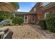 Brick home with patio, lounge set, blue hydrangeas, screened in porch, and grass at 9717 Waterton Ct, Huntersville, NC 28078