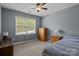 Neutral bedroom with hardwood furniture, and lots of natural light at 9717 Waterton Ct, Huntersville, NC 28078