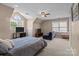 Oversized bedroom with many windows, 2 TVs, and sitting area at 9717 Waterton Ct, Huntersville, NC 28078