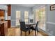 Charming breakfast nook with hardwood floors, natural light, and adjacent to the kitchen at 9717 Waterton Ct, Huntersville, NC 28078
