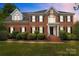 Beautiful brick home with a manicured lawn and mature landscaping for great curb appeal at 9717 Waterton Ct, Huntersville, NC 28078