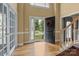 Bright foyer with hardwood floors and French doors leading to the open floorplan at 9717 Waterton Ct, Huntersville, NC 28078