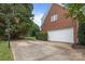 Spacious two-car garage with a basketball hoop on the driveway at 9717 Waterton Ct, Huntersville, NC 28078