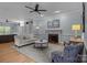 Cozy living room featuring hardwood floors, a fireplace, and stylish furnishings at 9717 Waterton Ct, Huntersville, NC 28078