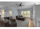 Spacious living room with hardwood floors, comfortable seating and an abundance of natural light at 9717 Waterton Ct, Huntersville, NC 28078