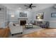 Inviting living room with hardwood floors, a fireplace, and elegant decor at 9717 Waterton Ct, Huntersville, NC 28078