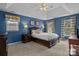 Cozy primary bedroom features tray ceilings, neutral carpet and lots of natural light at 9717 Waterton Ct, Huntersville, NC 28078