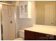 Bathroom features a combination tub and shower and vanity sink at 9823 Hyde Glen Ct, Charlotte, NC 28262