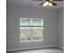 Bedroom featuring a window with natural light and ceiling fan at 9823 Hyde Glen Ct, Charlotte, NC 28262