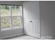 Bedroom boasts a closet, natural light from the window, and neutral paint at 9823 Hyde Glen Ct, Charlotte, NC 28262