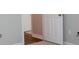 Bedroom featuring neutral paint, fresh carpeting, and wood floors in the hallway at 9823 Hyde Glen Ct, Charlotte, NC 28262