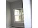 Bedroom featuring a large window providing ample natural light and neutral paint at 9823 Hyde Glen Ct, Charlotte, NC 28262
