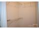 Walk-in closet features shelving for storage and organization at 9823 Hyde Glen Ct, Charlotte, NC 28262