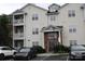 Well-maintained condo building features two stories and a parking lot at 9823 Hyde Glen Ct, Charlotte, NC 28262