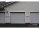 Attached multi-car garage offers ample parking and storage space at 9823 Hyde Glen Ct, Charlotte, NC 28262