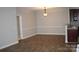 Spacious living and dining area with wood floors and neutral walls at 9823 Hyde Glen Ct, Charlotte, NC 28262
