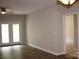 Bright living room features hardwood floors and access to another room at 9823 Hyde Glen Ct, Charlotte, NC 28262