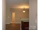 Open-concept area showcasing hardwood flooring and a view of the dining area at 9823 Hyde Glen Ct, Charlotte, NC 28262