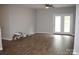 Bright living room features hardwood floors and access to outdoor space via double doors at 9823 Hyde Glen Ct, Charlotte, NC 28262