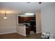 Open-concept living area provides ample space and a ceiling fan at 9823 Hyde Glen Ct, Charlotte, NC 28262
