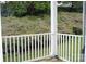 Exterior view from a patio featuring lush greenery and natural light at 9823 Hyde Glen Ct, Charlotte, NC 28262