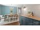 Inviting dining room showcases stylish decor and an adjacent kitchen island with granite countertops at 1027 Dresden W Dr, Charlotte, NC 28205