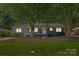 Charming single-story home featuring a freshly painted exterior, landscaped yard, and a welcoming front entrance at 1027 Dresden W Dr, Charlotte, NC 28205