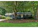 Charming single-story home featuring a freshly painted exterior, landscaped yard, and a welcoming front entrance at 1027 Dresden W Dr, Charlotte, NC 28205