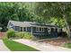 Charming single-story home featuring a freshly painted exterior, landscaped yard, and a welcoming front entrance at 1027 Dresden W Dr, Charlotte, NC 28205