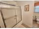 Bathroom featuring shower with sliding glass door and toilet at 10414 Tillman Steen Rd, Indian Land, SC 29720