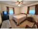 Carpeted bedroom with natural light, a ceiling fan, and traditional furnishings at 10414 Tillman Steen Rd, Indian Land, SC 29720