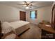 Bedroom featuring neutral walls, carpet flooring, and wooden furnishings at 10414 Tillman Steen Rd, Indian Land, SC 29720