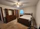 Bedroom with traditional furniture, ceiling fan and carpet flooring at 10414 Tillman Steen Rd, Indian Land, SC 29720