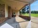 Brick carport of home with large yard and mature trees at 10414 Tillman Steen Rd, Indian Land, SC 29720