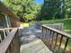Expansive backyard deck featuring a table and chairs, perfect for outdoor entertaining at 10414 Tillman Steen Rd, Indian Land, SC 29720