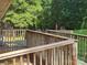 Wooden deck with railings and lattice work, providing a scenic view of the backyard at 10414 Tillman Steen Rd, Indian Land, SC 29720