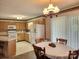 Kitchen and dining area with natural light and light wood cabinets at 10414 Tillman Steen Rd, Indian Land, SC 29720