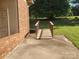 Backyard patio featuring a ramp, accessible from the brick home's exterior at 10414 Tillman Steen Rd, Indian Land, SC 29720