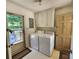 Laundry room featuring white washer and dryer with access to the exterior at 10414 Tillman Steen Rd, Indian Land, SC 29720
