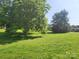 Lush green yard with mature trees, enhancing the property's natural beauty at 10414 Tillman Steen Rd, Indian Land, SC 29720